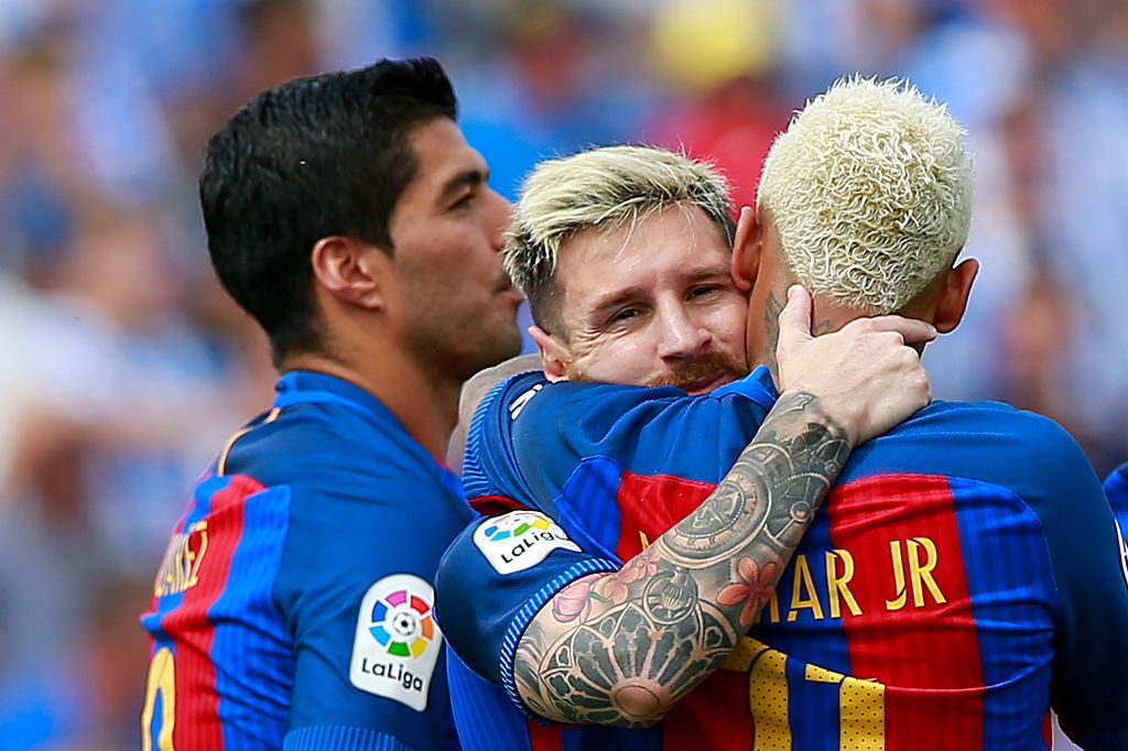 LEGANES, SPAIN - SEPTEMBER 17: Lionel Messi (L) celebrates scoring their fourth goal with teammates Neymar JR. (R) and Luis Suarez (L)  during the La Liga match between Deportivo Leganes and FC Barcelona at Estadio Municipal de Butarque on September 17, 2016 in Leganes, Spain. (Photo by Gonzalo Arroyo Moreno/Getty Images)