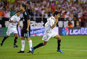 SEVILLE, SPAIN - OCTOBER 04: Jesus Navas of Sevilla (R) celebrates scoring the opening goal during the La Liga match between Sevilla and Real Madrid at the Estadio Ramon Sanchez Pizjuan on October 4, 2009 in Seville, Spain. (Photo by Jasper Juinen/Getty Images)