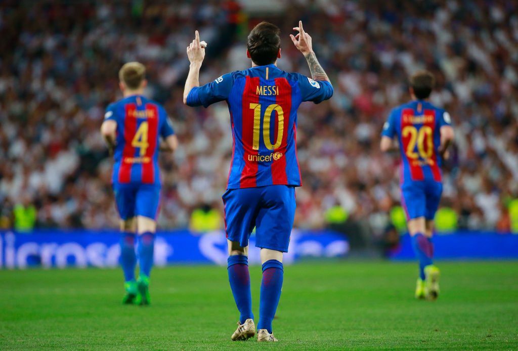 MADRID, SPAIN - APRIL 23: Lionel Messi of Barcelona (10) celebrates as he scores their first and equalising goal with team mates during the La Liga match between Real Madrid CF and FC Barcelona at Estadio Bernabeu on April 23, 2017 in Madrid, Spain. (Photo by Gonzalo Arroyo Moreno/Getty Images)