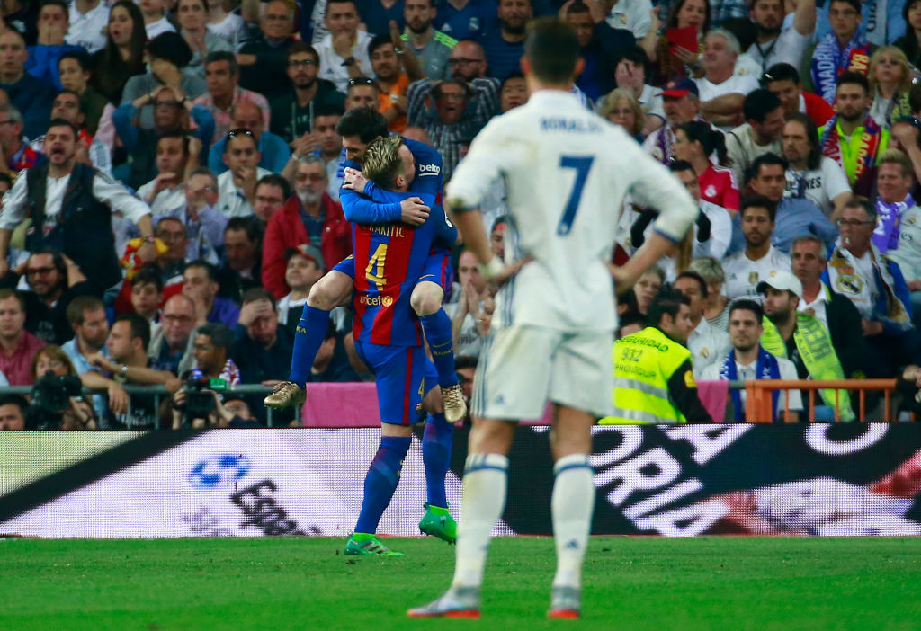 MADRID, SPAIN - APRIL 23: Ivan Rakitic of Barcelona (4) celebrates as he scores their second goal with Lionel Messi of Barcelona as Cristiano Ronaldo of Real Madrid looks dejected during the La Liga match between Real Madrid CF and FC Barcelona at Estadio Bernabeu on April 23, 2017 in Madrid, Spain. (Photo by Gonzalo Arroyo Moreno/Getty Images)