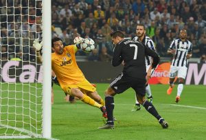 TURIN, ENGLAND - MAY 05: Cristiano Ronaldo of Real Madrid CF heads the ball past goalkeeper Gianluigi Buffon of Juventus to score their first and equalising goal during the UEFA Champions League semi final first leg match between Juventus and Real Madrid CF at Juventus Arena on May 5, 2015 in Turin, Italy. (Photo by Michael Regan/Getty Images)